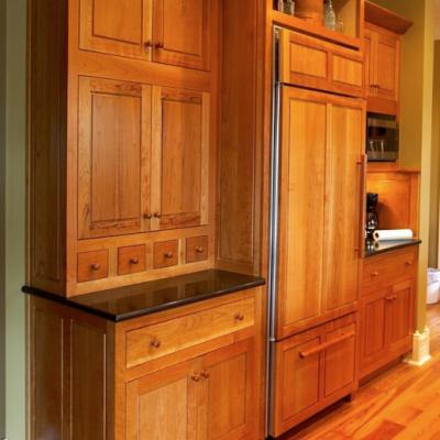 Cherry kitchen with paneled refrigerator 