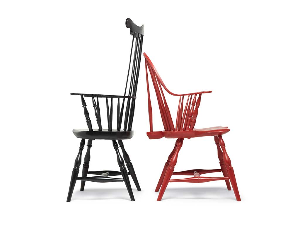 black comb-back and red sack-back windsor chair