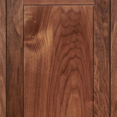 walnut kitchen cabinet door with scalloped patterned front