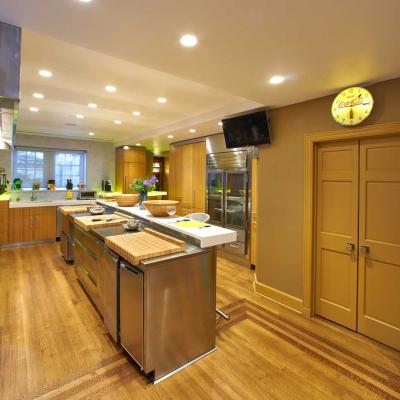 Custom bamboo kitchen with block cutting boards over stainless countertops